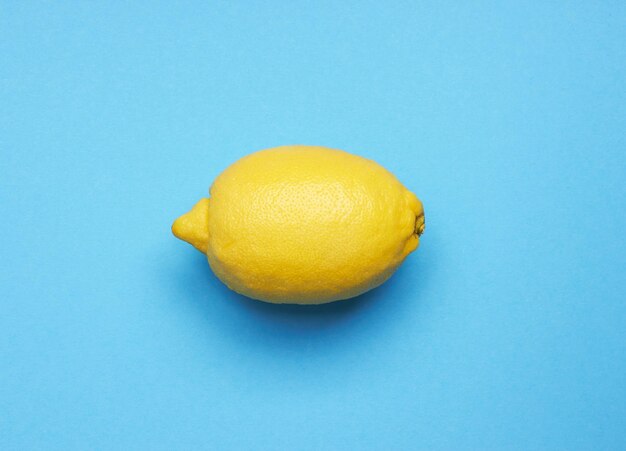 Ripe lemon on blue