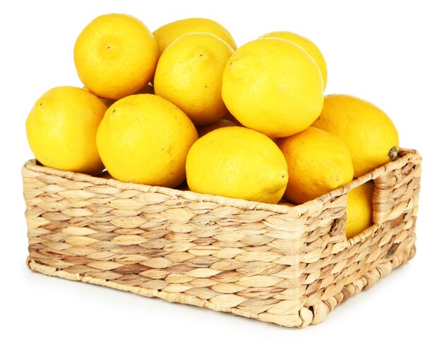 Ripe lemons in wicker basket isolated on white