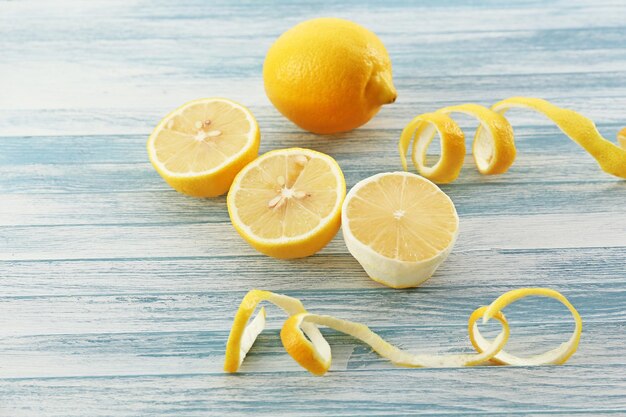 Ripe lemons on wooden table close up