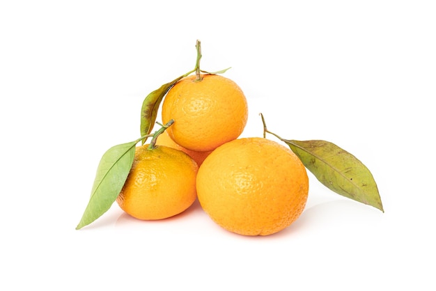 Ripe mandarines with leaves closeup on a white background