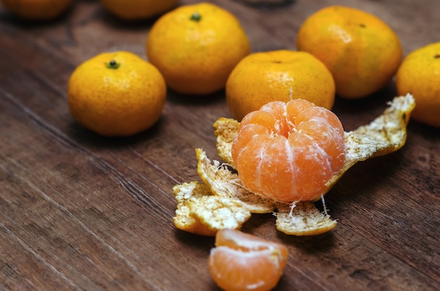 Ripe mandarines on wooden table