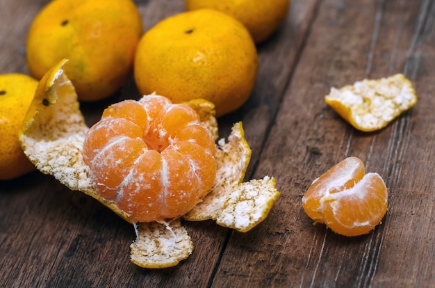 Ripe mandarines on wooden table