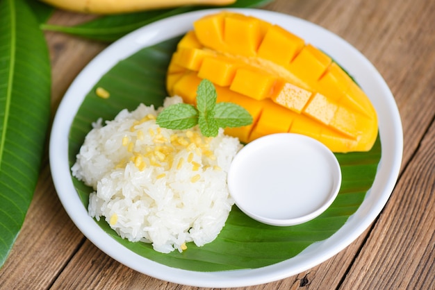 Ripe mango rice cooked with coconut milk, Asian Thai dessert tropical sweet mango fruit food