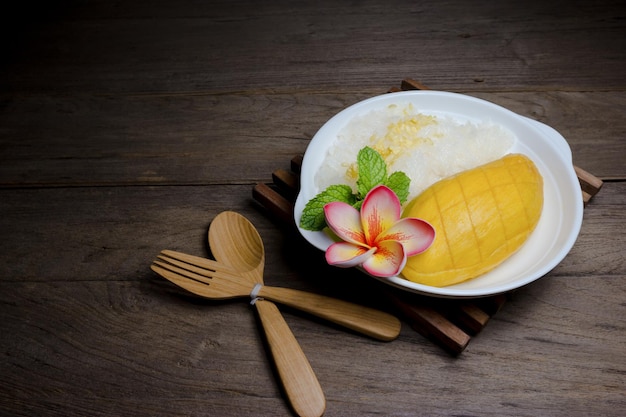 Ripe Mango with sticky rice on wood backgroundstill life