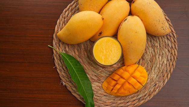 Ripe mango on woodRipe Mango Slice on wooden cutting board