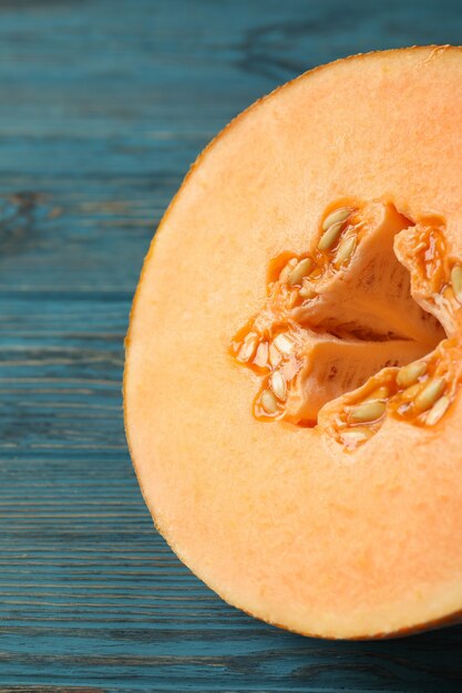 Ripe melon on wooden table, close up