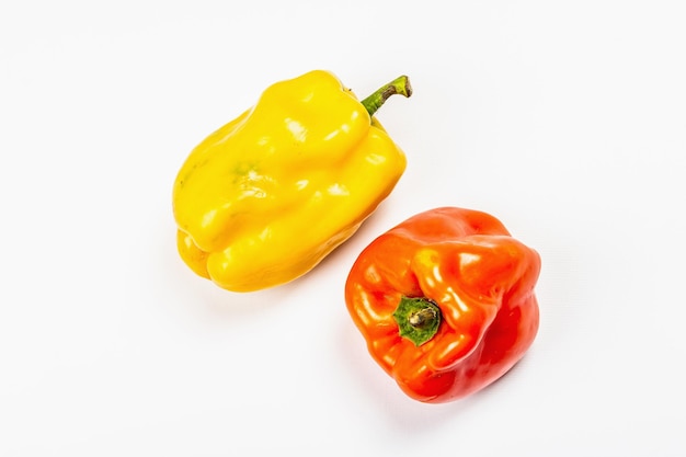 Ripe multicolored peppers isolated on white background. Fresh vegetables, ingredient for cooking healthy food