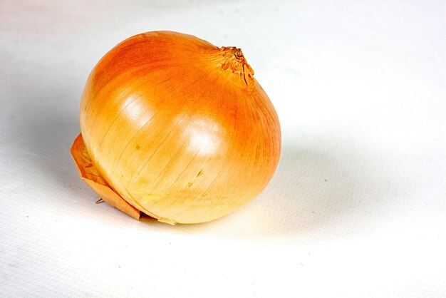 Ripe onion on a white background