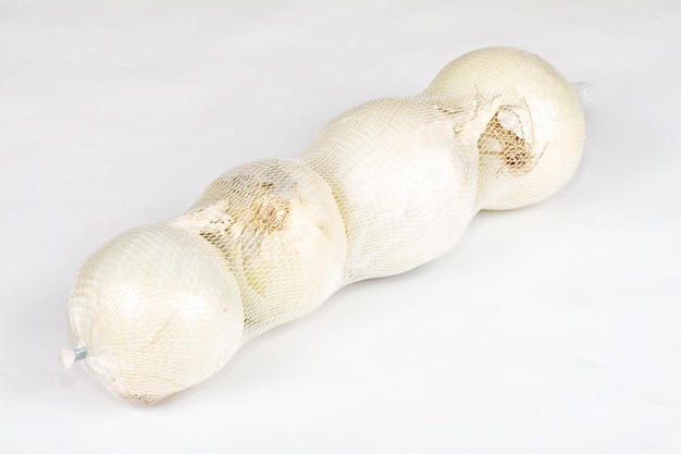 Ripe onion on a white