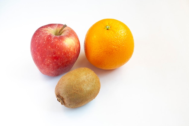 Ripe orange, apple and kiwi, isolated on a white