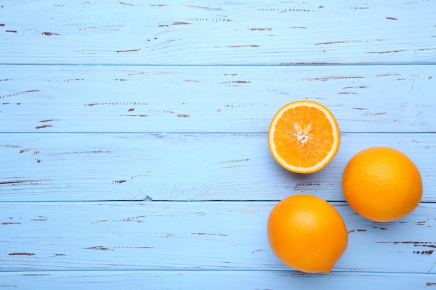 Ripe orange fruit on a blue