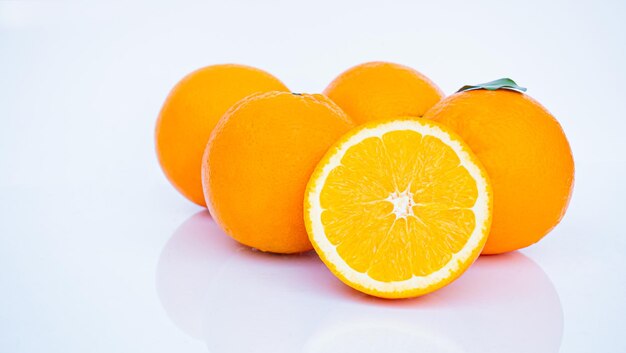 Ripe Orange Golden Yellow Peel Lots on white background with shadows and reflections