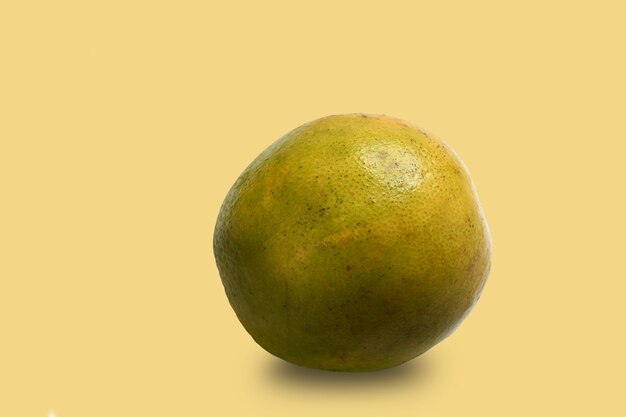 Ripe orange isolated on yellow background