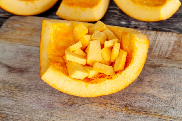 Ripe orange pumpkin while cooking food in the kitchen