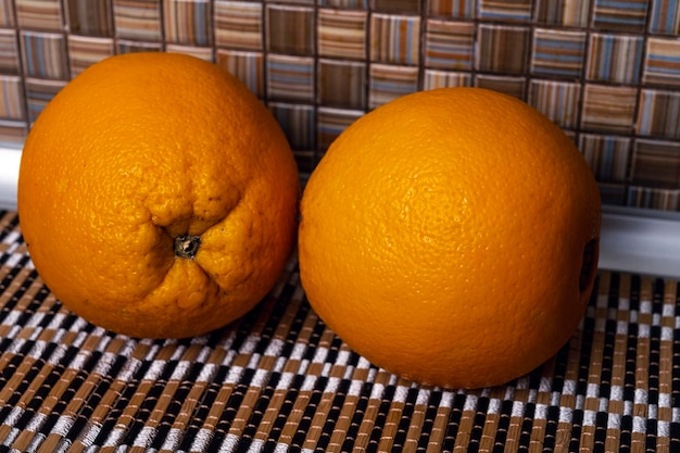 Ripe oranges lie on the table