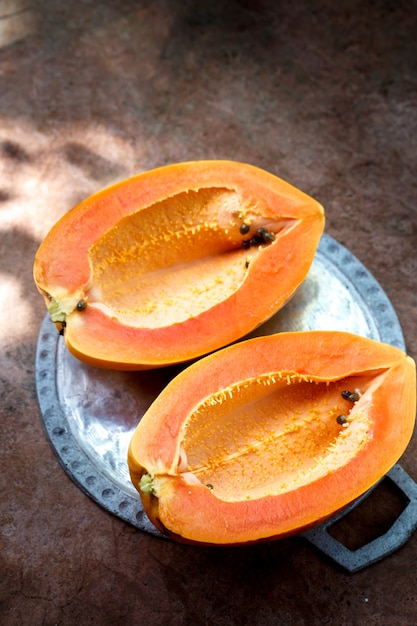 Ripe papaya without seeds cut into two halves