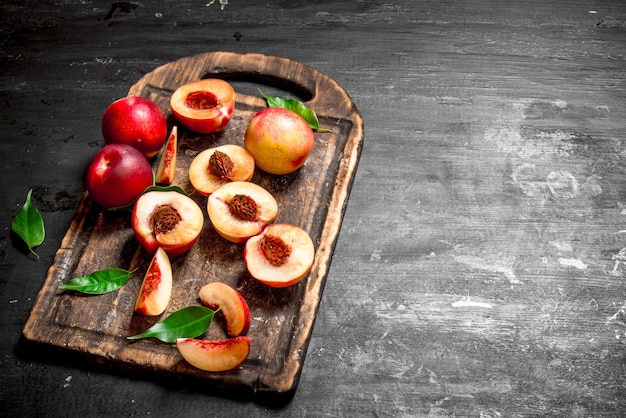 Ripe peaches on a cutting Board.