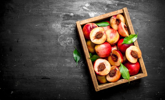 Ripe peaches in an old box.