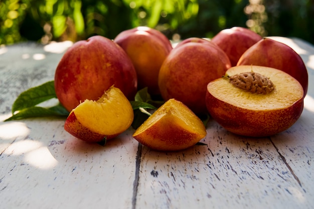 Ripe peaches on an old wooden table