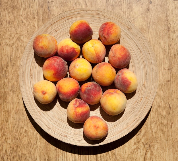 Ripe peaches on a plate