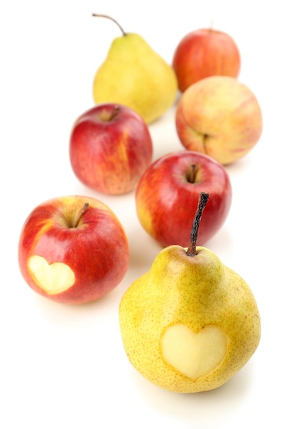 Ripe pear and apple with heart isolated on white