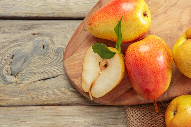 Ripe pears on rustic wooden table