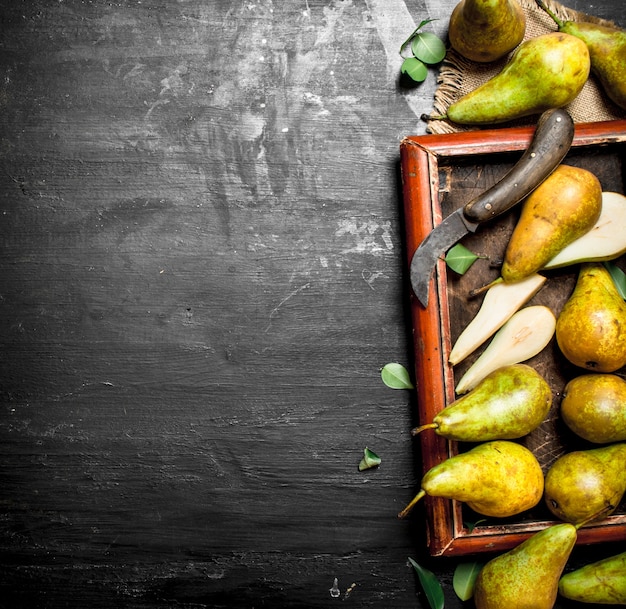 Ripe pears on wooden table