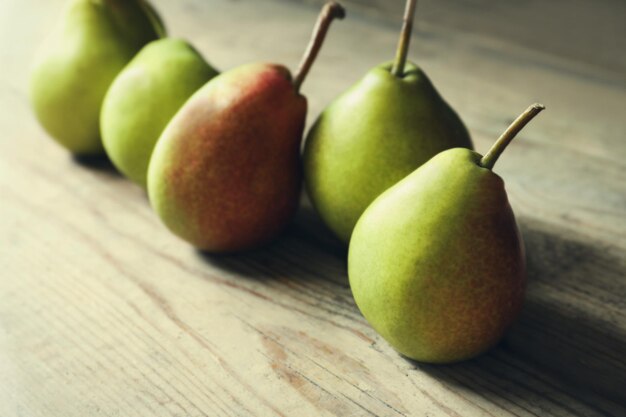 Ripe pears on wooden table