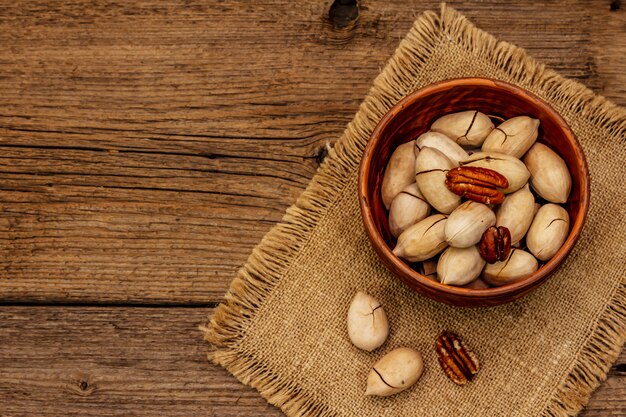 Ripe pecan on vintage wooden table