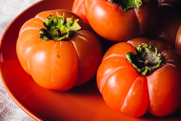 Ripe Persimmons on Plate