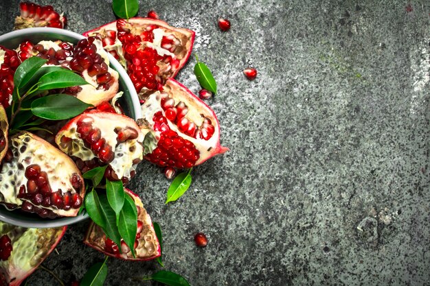 Ripe pieces of pomegranate in a bowl.