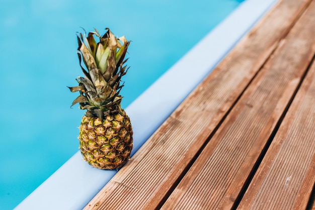 Ripe pineapple near pool