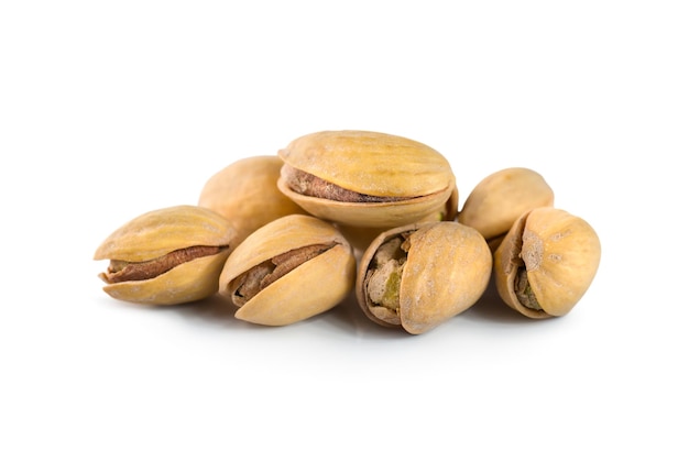 Ripe pistachios isolated on white background