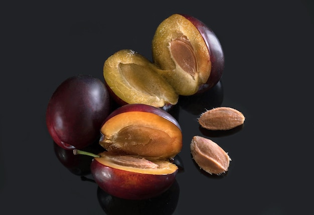 Ripe plums closeup on dark background