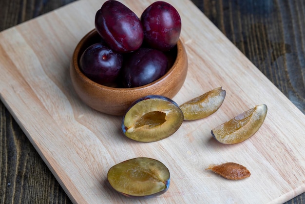 Ripe plums on the table in the kitchen several ripe and delicious plums on the table during meals