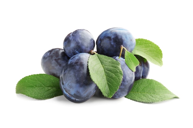 Ripe plums on white background