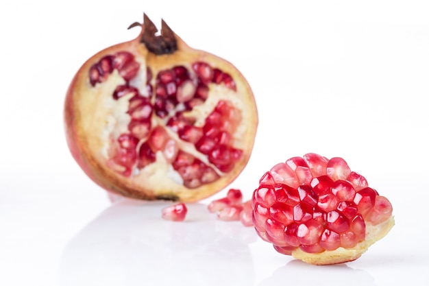 Ripe pomegranate fruit isolated on white