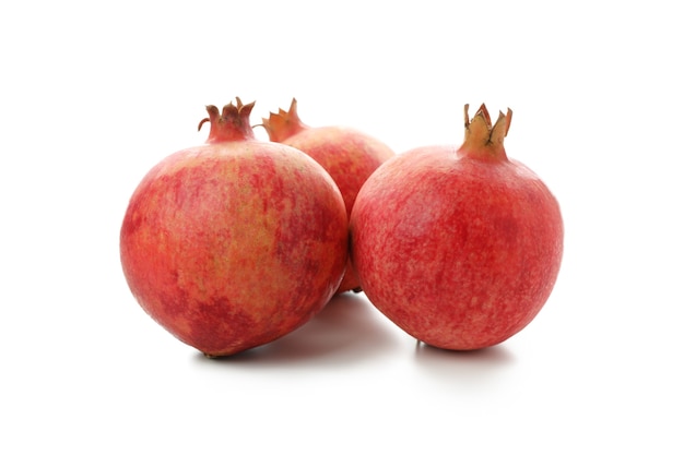 Ripe pomegranate fruits isolated on white background