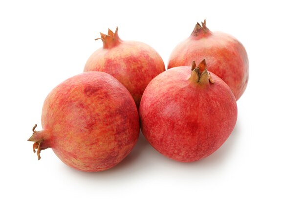 Ripe pomegranate fruits isolated on white background