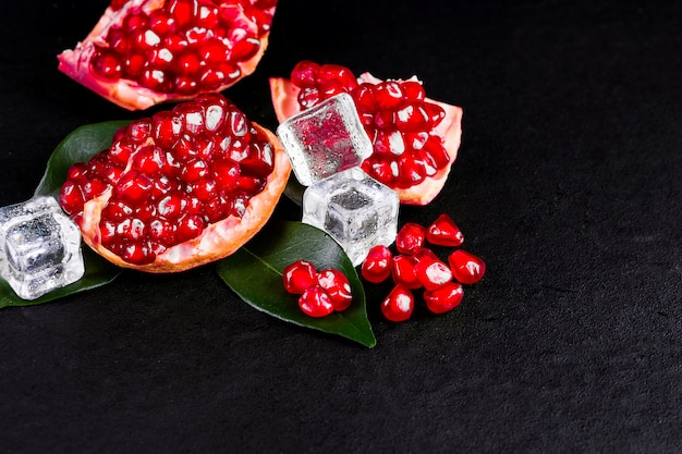 Ripe pomegranate fruits on the wooden table