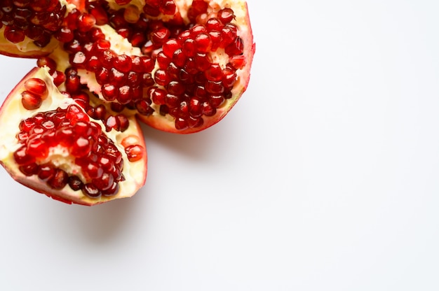 Ripe pomegranate on white background, top view