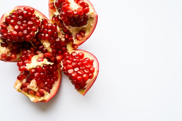 Ripe pomegranate on white background, top view