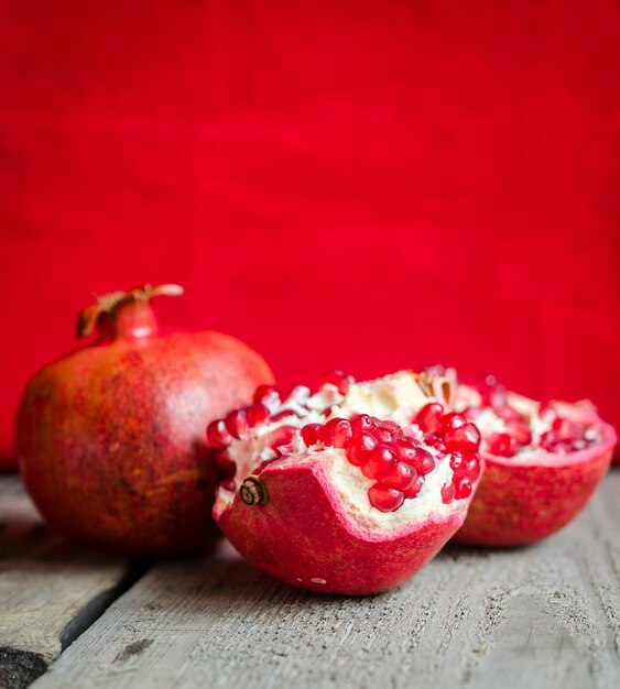 Ripe pomegranate on wooden table