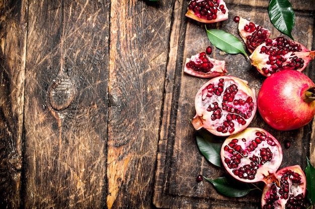 Ripe pomegranates on a cutting Board.