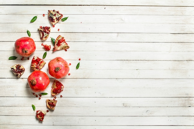 Ripe pomegranates with leaves.