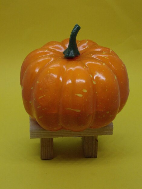 Ripe pumpkin for halloween on the background of the holiday and mystical items