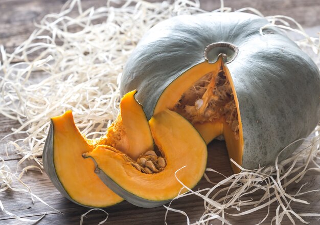 Ripe pumpkin on the wooden surface