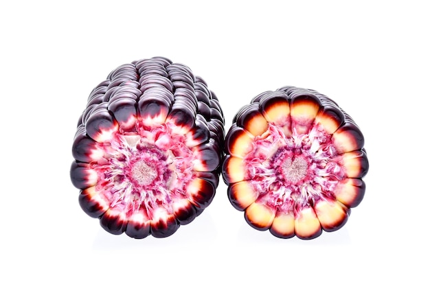 Ripe purple corn on white background