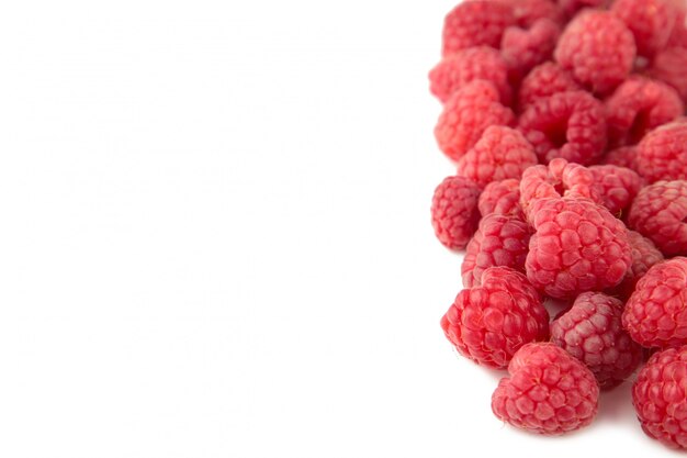 Ripe raspberries isolated on white background.