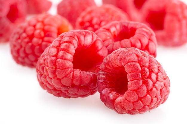 Ripe raspberries isolated on white background